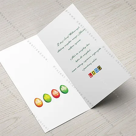 Rząd czterech jaj na białym tle po lewej stronie wnętrza oraz tekst życzeń z logo po prawej